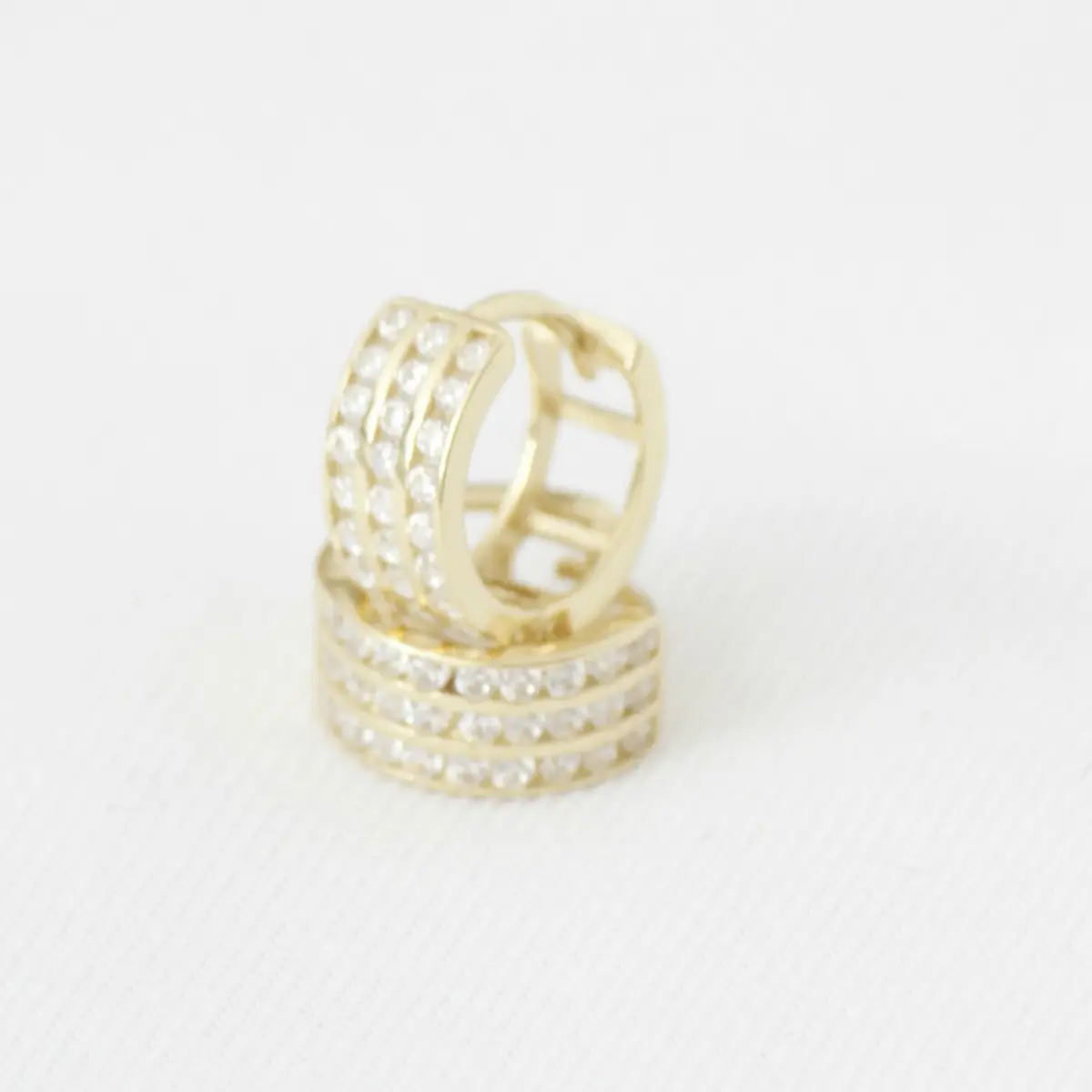 Gold pavé huggie hoop earrings